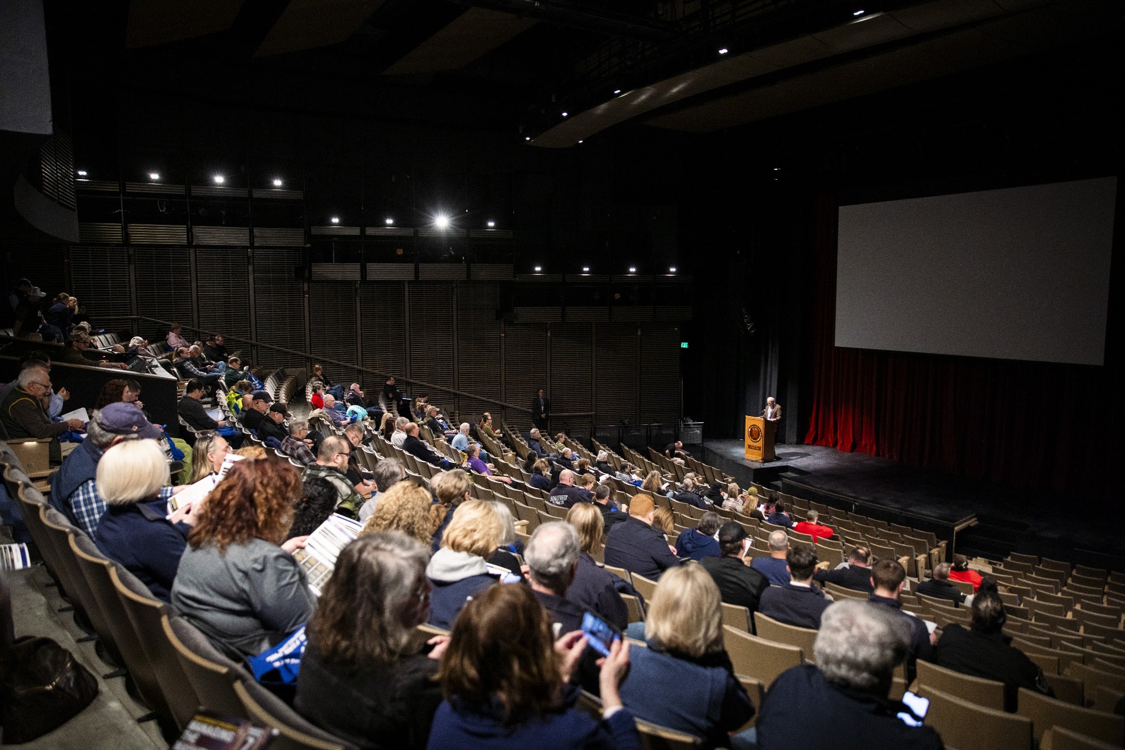EMS symposium attendees listen to a presentation in the Hotchkiss School auditorium.